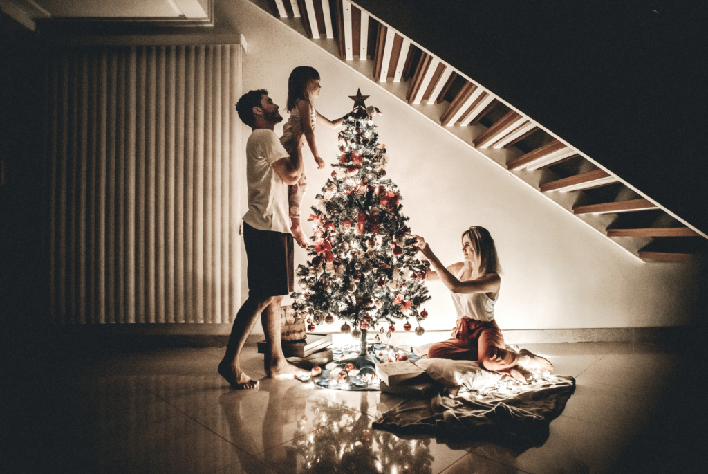 Family fitting Jesus into their tree-decorating tradition.
