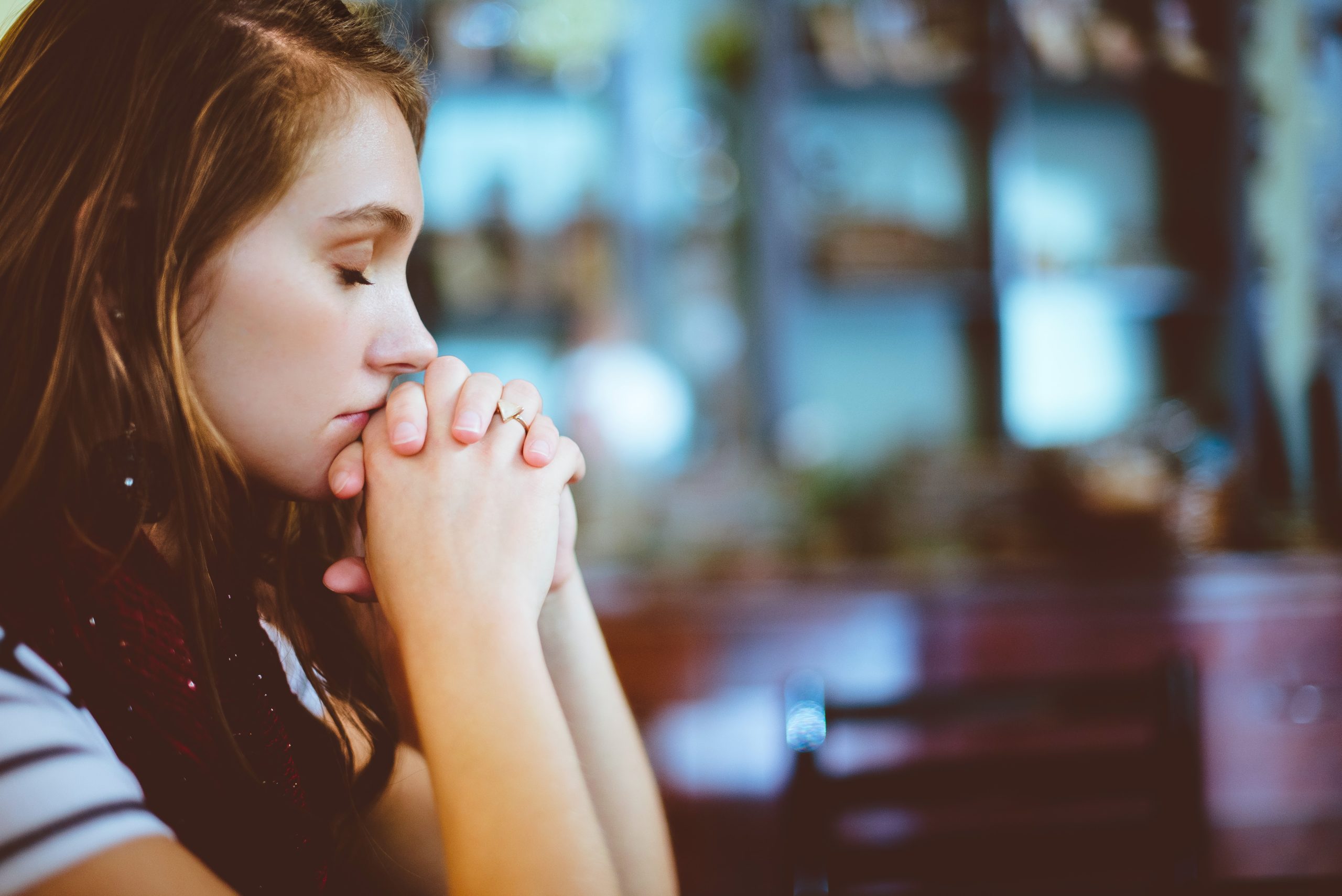 Image of brown haired girl praying scripture for healing and prayer