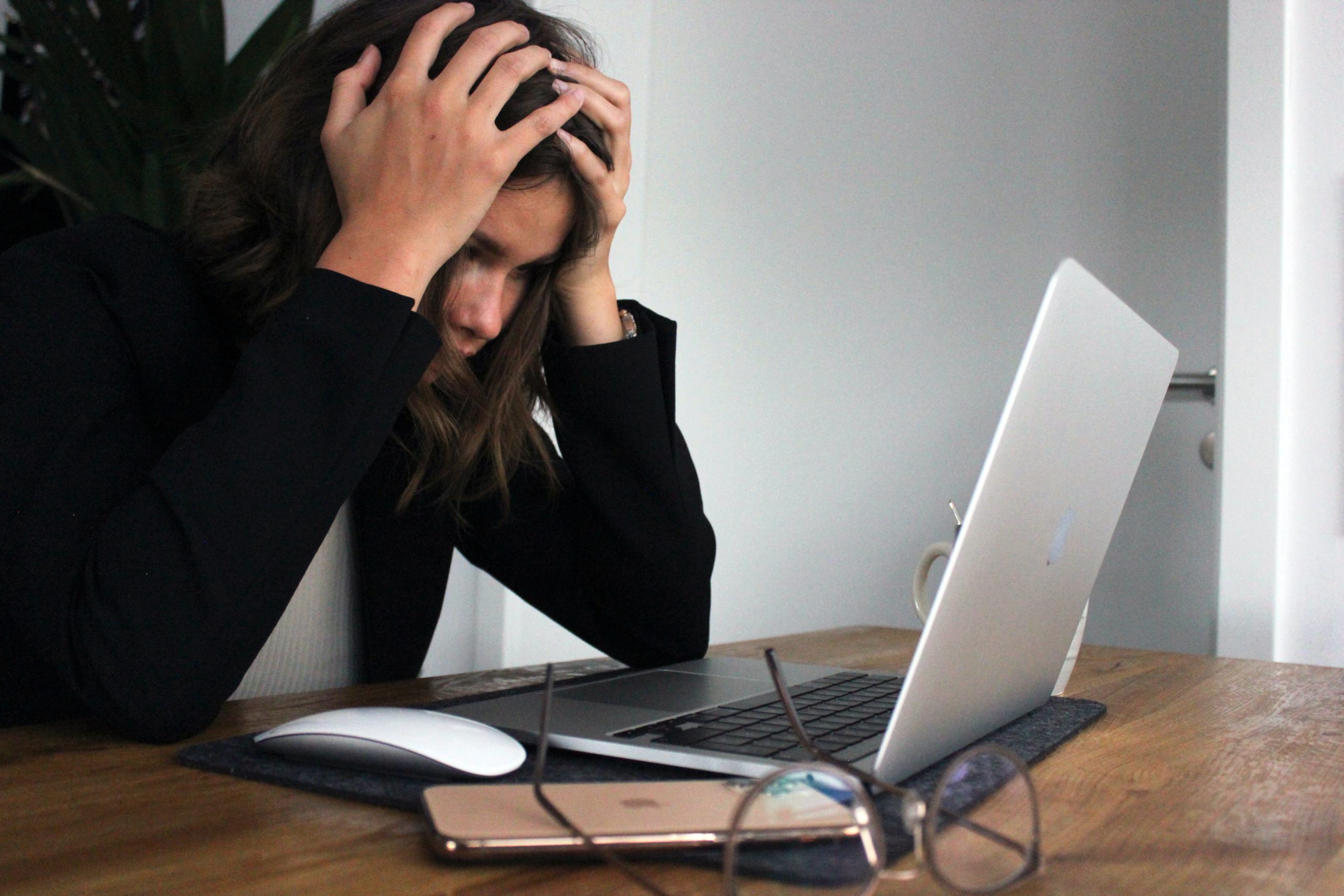 Stressed Woman at Computer to symbolize that we need short prayers for stressful situations